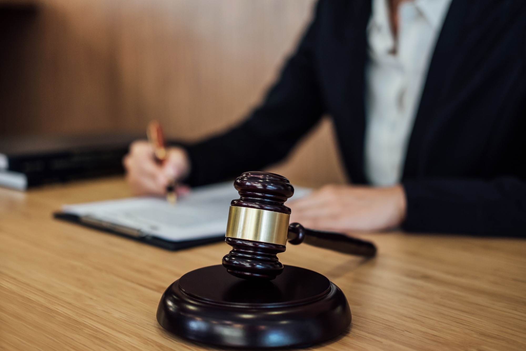 Judge gavel with Justice lawyers, Businesswoman in suit or lawyer working on a documents